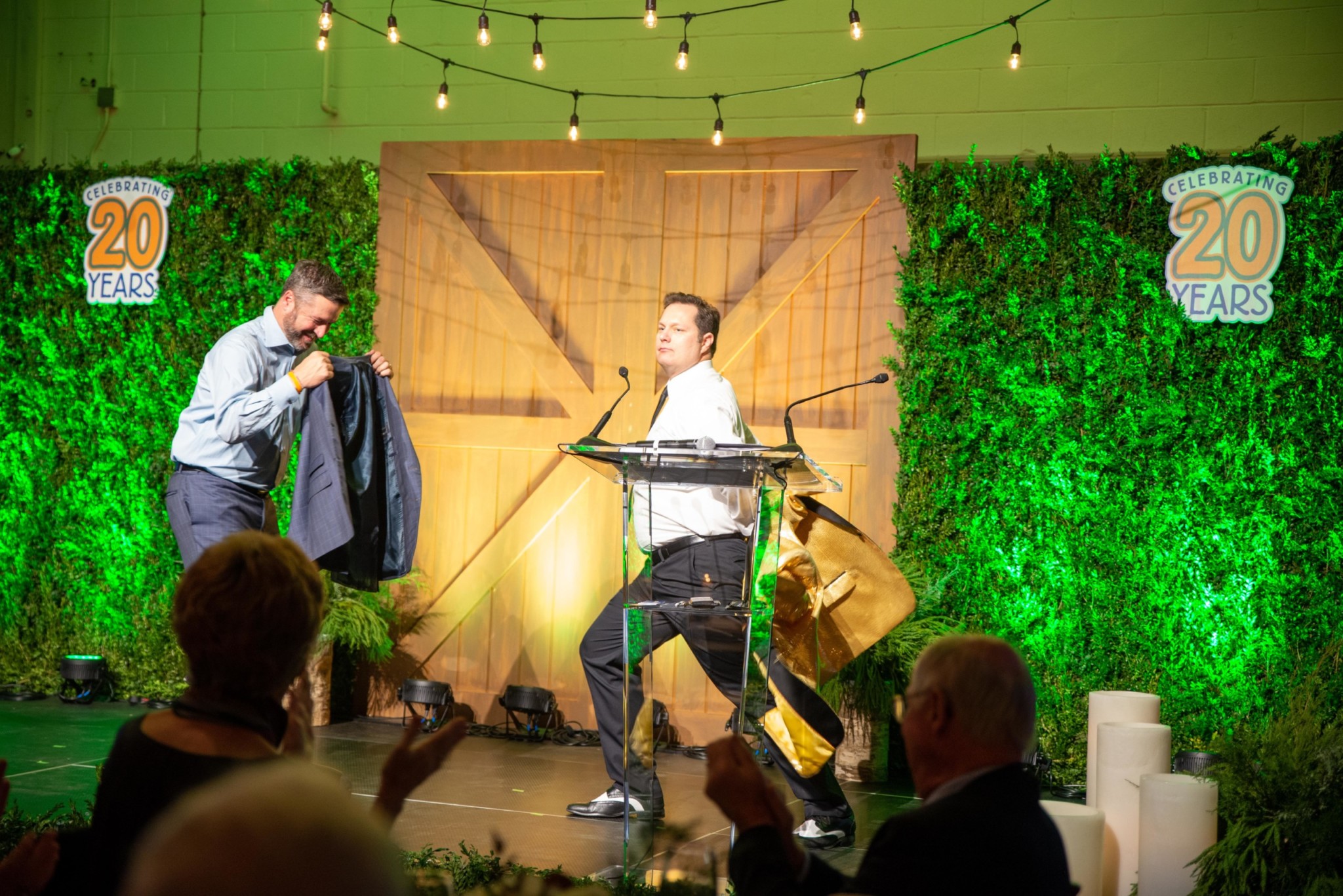 Man hosting an auction at a Camp Kudzu event