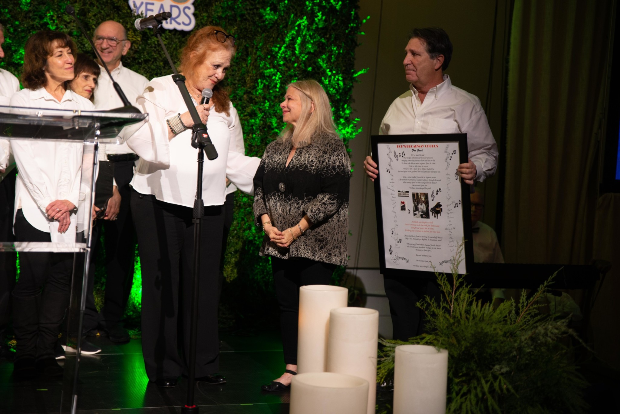 Woman accepting an award at a Camp Kudzu event