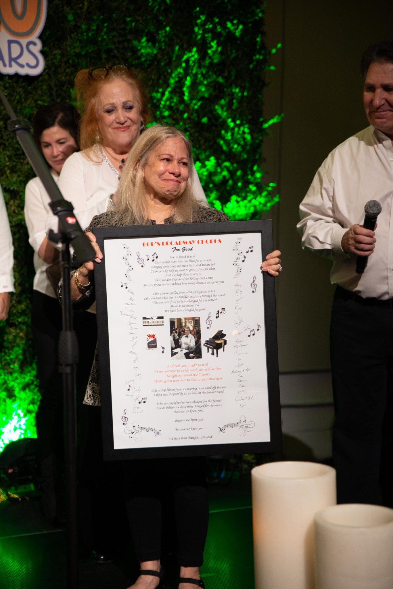 Woman accepting an award at a Camp Kudzu event