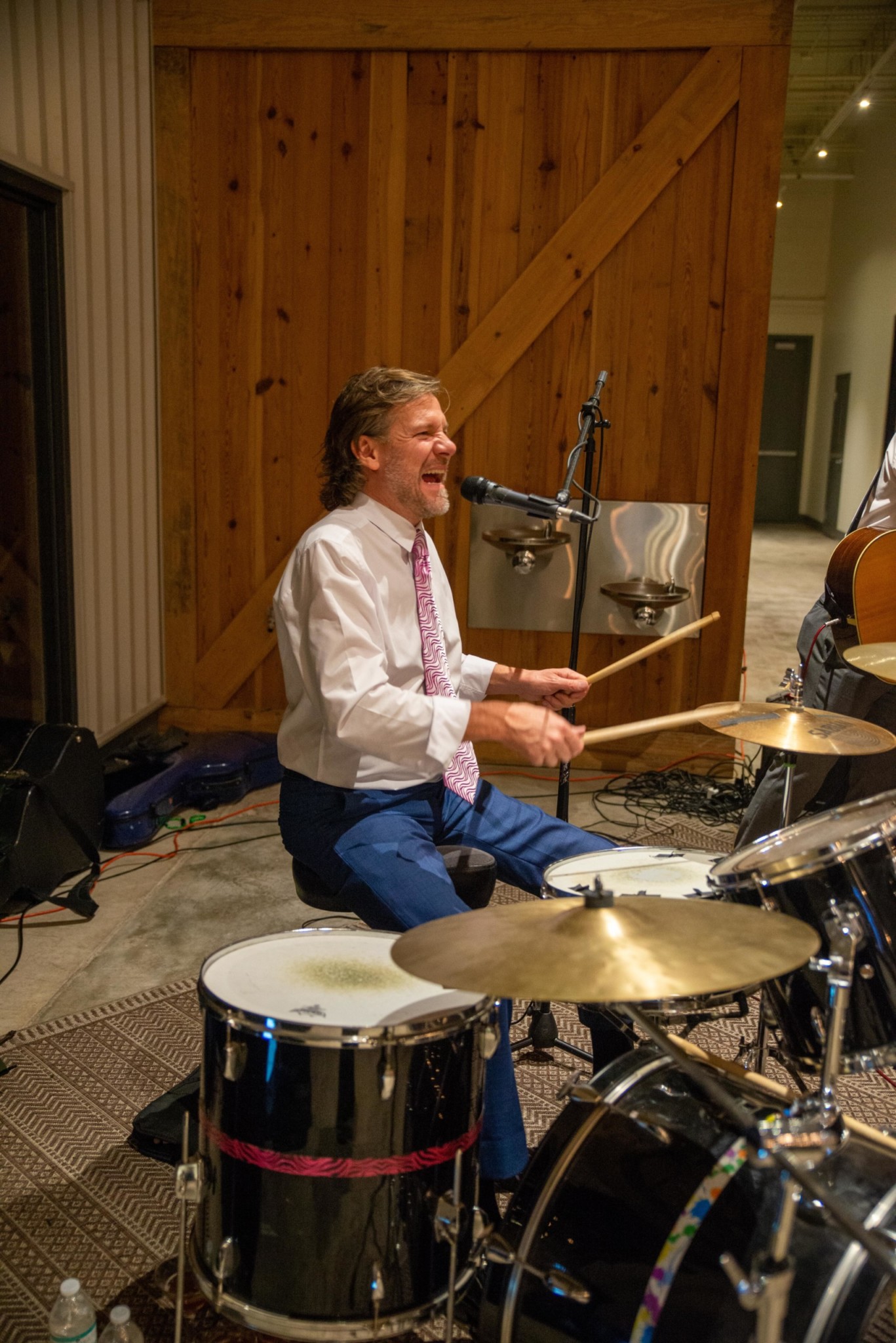 Drummer playing in a band at a Camp Kudzu event