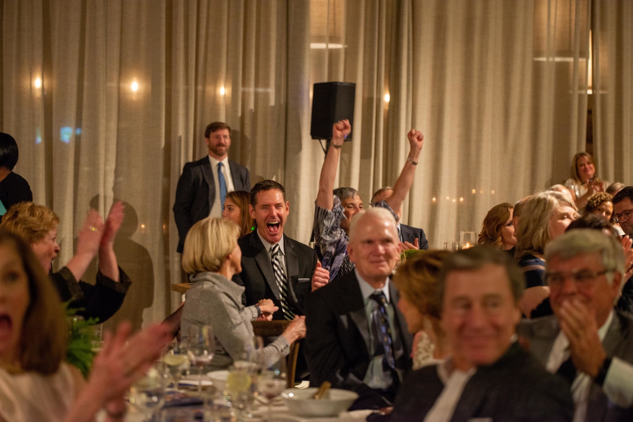 Event attendees celebrating at a Camp Kudzu event